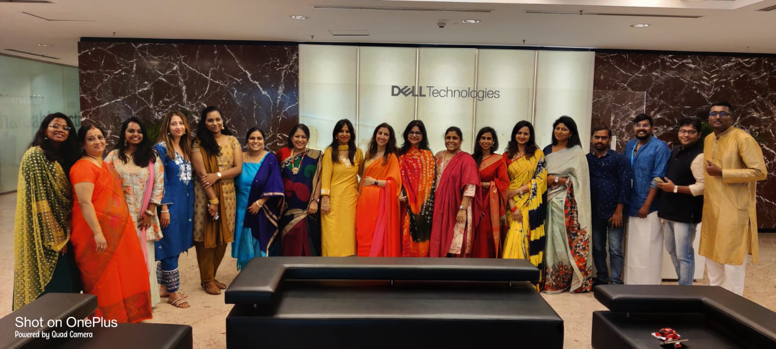 A group of women smile together.