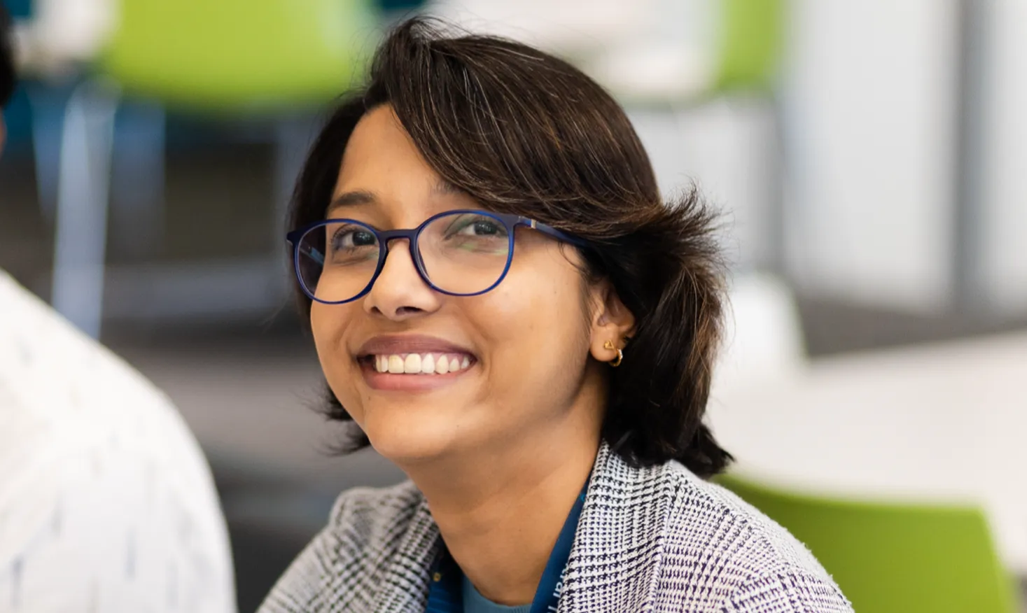Smiling woman with a joyful expression.